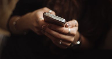 Woman Holding phone, close up of hands